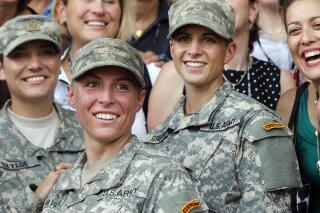 FILE - In this Aug. 21, 2015, file photo, Army 1st Lt. Shaye Haver, center, and Capt. Kristen Griest, right, pose for photos with other female West Point alumni after an Army Ranger school graduation ceremony at Fort Benning, Ga. Haver and Griest became the first female graduates of the Army's rigorous Ranger School. (AP Photo/John Bazemore, File)