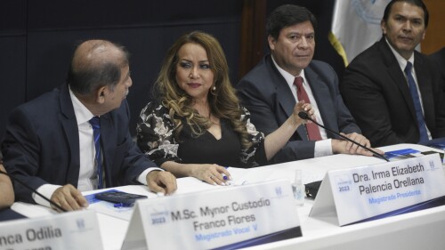 Supreme Electoral Tribunal magistrates hold a press conference in Guatemala City, Wednesday, July 12, 2023. The tribunal certified presidential election results, sending candidates Sandra Torres and Bernardo Arévalo to an Aug. 20 runoff, while the Attorney General's Office announced that Arevalo´s party had been suspended. (AP Photo/Wilder Lopez)