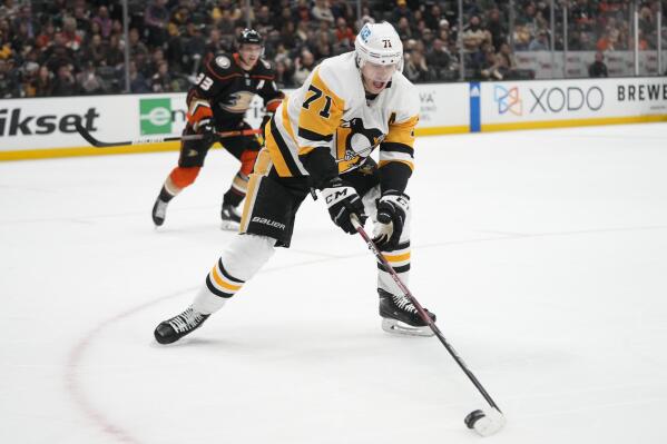 Pittsburgh Penguins' Evgeni Malkin (71) moves the puck during the second period of an NHL hockey game against the Anaheim Ducks, Friday, Feb. 10, 2023, in Anaheim, Calif. (AP Photo/Jae C. Hong)