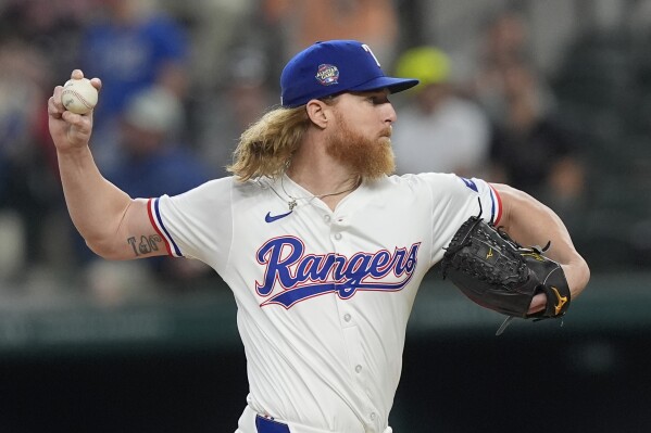 Texas Rangers pitcher Jon Gray throws during the first inning of a baseball game against the Cleveland Guardians in Arlington, Texas, Wednesday, May 15, 2024. (AP Photo/LM Otero)