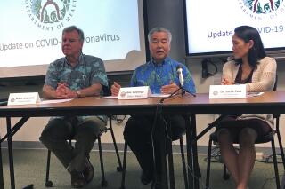 In this Feb. 14, 2020, file photo Hawaii Gov. David Ige, center, state Health Director Bruce Anderson, left, and state Epidemiologist Sarah Park, right, in Honolulu discuss a tourist who was confirmed with the coronavirus after returning home to Japan. A review of Ige's emails shows the state epidemiologist spent key weeks in the early days of the coronavirus pandemic resisting suggestions and requests from both inside and outside the administration that she boost contract tracing to control the spread of COVID-19. (AP Photo/Jennifer Sinco Kelleher, File)