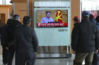
              People watch a TV screen showing North Korean leader Kim Jong Un's New Year's speech, at Seoul Railway Station in Seoul, South Korea, Wednesday, Jan. 3, 2018. North Korea announced Wednesday that it will reopen a cross-border communication channel with South Korea, officials in Seoul said, another sign of easing animosity between the rivals after a year that saw the North conduct nuclear bomb and missile tests and both the Koreas and Washington issue threats of war. The letters on the screen read: "Welcomed South Korea's suggestions." (AP Photo/Ahn Young-joon)
            
