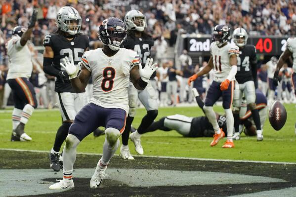 Chicago Bears running back Damien Williams (8) reacts after scoring at touchdown against the Las Vegas Raiders during the first half of an NFL football game, Sunday, Oct. 10, 2021, in Las Vegas. (AP Photo/Rick Scuteri)