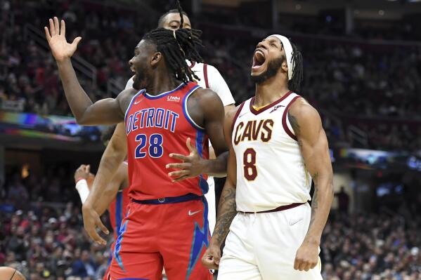 Cleveland Cavaliers' Lamar Stevens (8) celebrates a dunk against Detroit Pistons' Isaiah Stewart (28) during the first half of an NBA basketball game Saturday, March 19, 2022, in Cleveland. (AP Photo/Nick Cammett)