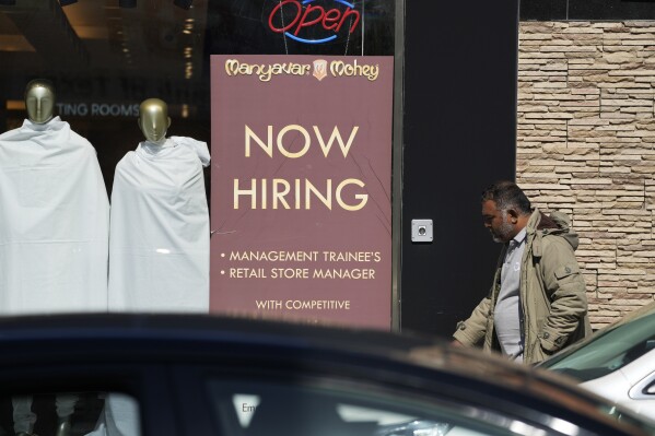 A hiring sign is displayed at a retail store in Chicago on Monday, March 11, 2024. On Thursday, March 14, 2024, the Labor Department reports on the number of people who applied for unemployment benefits last week. (AP Photo/Nam Y. Huh)