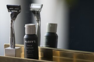 FILE - In this June 15, 2018, file photo, the Winston razor and Harry's face lotion are on display at the headquarters of Harry's Inc., in New York. Federal antitrust regulators say a proposed merger that would combine old-school shaving company Schick with upstart Harry's would end up costing consumers some skin. (AP Photo/Mary Altaffer, File)