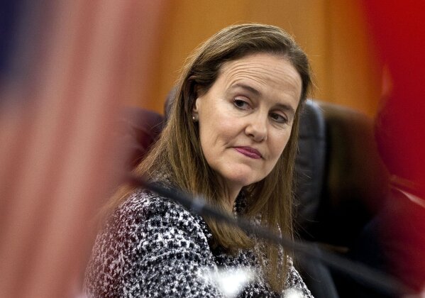 FILE - This Dec. 7, 2011 file photo shows former U.S. Defense Undersecretary Michele Flournoy, preparing for a bilateral meeting in Beijing, China. Flournoy, a politically moderate Pentagon veteran, is regarded by U.S. officials and political insiders as a top choice for President-elect Joe Bide to choose to head the Pentagon. (AP Photo/Andy Wong, File)