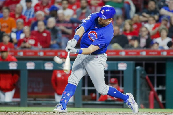 FILE - In this May 15, 2019, file photo,  Chicago Cubs' Kyle Schwarber hits a solo home run off Cincinnati Reds relief pitcher David Hernandez in the eighth inning of a baseball game in Cincinnati. Schwarber agreed in principle to a one-year, $10 million contract with the Washington Nationals, according to a person familiar with the deal. The person confirmed the agreement to The Associated Press on condition of anonymity on Saturday, Jan. 9, 2021,  because a physical exam was still pending for Schwarber. (AP Photo/John Minchillo, File)