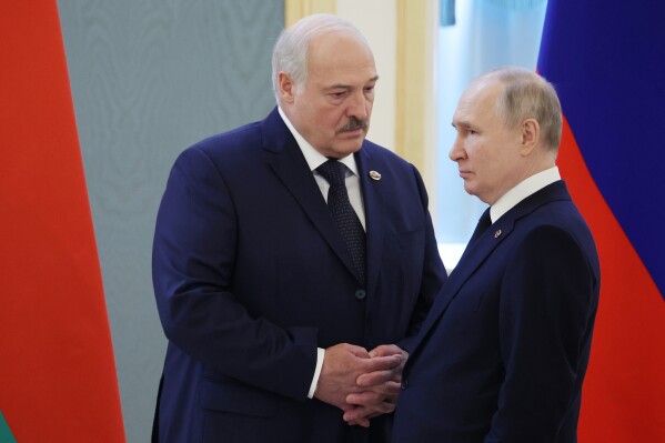 FILE - Belarusian President Alexander Lukashenko, left, and Russian President Vladimir Putin talk prior to the Supreme State Council of the Union State Russia-Belarus meeting in Moscow, Russia, April 6, 2023. Sometime this summer, if President Vladimir Putin can be believed, Russia moved some of its short-range nuclear weapons into Belarus, closer to Ukraine and onto the doorstep of NATO’s members in Central and Eastern Europe. (Mikhail Klimentyev, Sputnik, Kremlin Pool Photo via AP, File)
