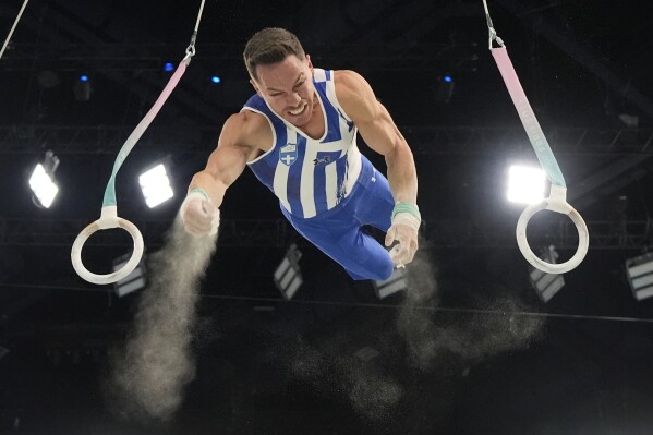 Eleftherios Petrounias, of Greece, competes during the men's artistic gymnastics individual rings finals at Bercy Arena at the 2024 Summer Olympics, Sunday, Aug. 4, 2024, in Paris, France. (AP Photo/Charlie Riedel)