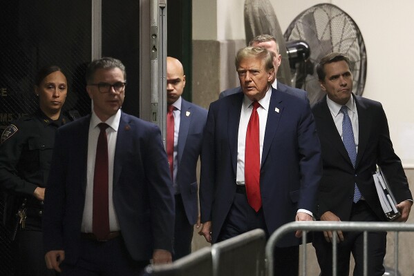 Former president Donald Trump arrives at Manhattan criminal court, Tuesday, April 23, 2024, in New York. Before testimony resumes Tuesday, the judge will hold a hearing on prosecutors' request to sanction and fine Trump over social media posts they say violate a gag order prohibiting him from attacking key witnesses. (AP Photo/Yuki Iwamura, Pool)