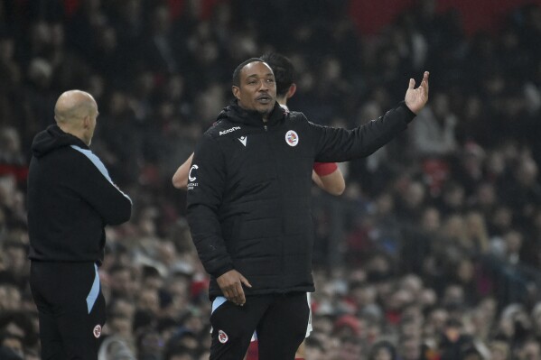 FILE - Reading manager Paul Ince gestures to his players during the English FA Cup 4th round soccer match between Manchester United and Reading at Old Trafford in Manchester, England, Saturday, Jan. 28, 2023. Racism has long permeated the world's most popular sport, with soccer players subjected to racist chants and taunts online. While governing bodies like FIFA and UEFA have taken steps to combat the abuse of players, the lack of diversity in the upper ranks at major clubs remains an unsolved problem. Ince began his managerial career with then-fourth division team Macclesfield. His only top flight job was with Blackburn in 2008. He was fired after less than six months and has not been hired by a Premier League club since. (AP Photo/Rui Vieira, File)
