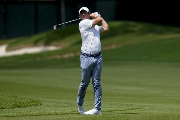 Rory McIlroy, of Northern Ireland, hits from the first fairway during the third round of the Tour Championship golf tournament, Sunday, Aug. 27, 2023, in Atlanta. (AP Photo/Mike Stewart)