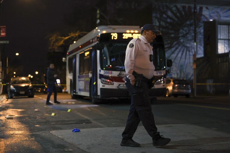 Police respond to a deadly shooting on a SEPTA bus in South Philadelphia on Tuesday, March 5, 2024. A passenger shot aboard the bus has died from his wounds, marking the third time in three days that someone was killed while riding, entering or leaving a SEPTA bus. (Heather Khalifa/The Philadelphia Inquirer via AP)