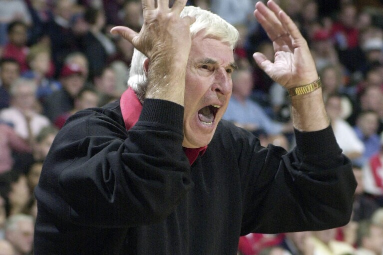 FILE - Texas Tech coach Bob Knight yells from the sidelines in the first half of a college basketball game against Houston, Dec. 14, 2001 in Houston. Bob Knight, the brilliant and combustible coach who won three NCAA titles at Indiana and for years was the scowling face of college basketball has died. He was 83. Knight's family made the announcement on social media Wednesday evening, Nov. 1, 2023. (AP Photo/Pat Sullivan, File)