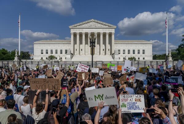 Abortion-rights and anti-abortion demonstrators gather outside of the Supreme Court in Washington, Friday, June 24, 2022. The Supreme Court has ended constitutional protections for abortion that had been in place nearly 50 years, a decision by its conservative majority to overturn the court's landmark abortion cases. (AP Photo/Gemunu Amarasinghe)