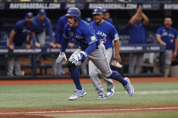 Springer has 2 HRs and 4 RBIs, Toronto beats Royals 5-1 as Greinke