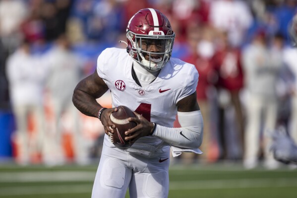 Alabama quarterback Jalen Milroe looks to throw during the second half of an NCAA college football game against Kentucky in Lexington, Ky., Saturday, Nov. 11, 2023. (AP Photo/Michelle Haas Hutchins)