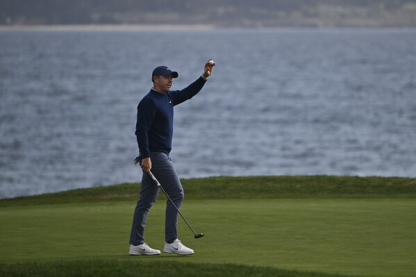 Rory McIlroy, of Northern Ireland, reacts after putting on the 18th hole at Pebble Beach Golf Links during the final round to win the AT&T Pebble Beach Pro-Am golf tournament, Sunday, Feb. 2, 2025, in Pebble Beach, Calif. (AP Photo/Nic Coury)