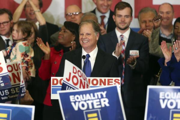 FILE - In this Tuesday, Dec. 12, 2017 file photo, Democrat Doug Jones speaks in Birmingham, Ala.  Roy Moore is going to court to try to stop Alabama from certifying Jones as the winner of the U.S. Senate race. Moore filed a lawsuit Wednesday evening, Dec. 27, 2017, in Montgomery Circuit Court.  (AP Photo/John Bazemore, File)