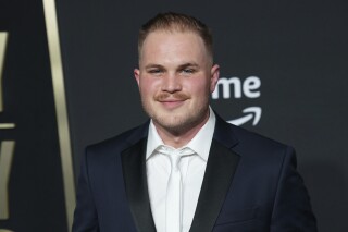 FILE - Zach Bryan arrives at the 58th annual Academy of Country Music Awards on Thursday, May 11, 2023, at the Ford Center in Frisco, Texas. Bryan says he was arrested and jailed briefly in northeastern Oklahoma. According to a post on his account on the social media site X, formerly Twitter, Bryan wrote that he had an incident with the Oklahoma Highway Patrol on Thursday night and said some things that were out of line because he was frustrated. (AP Photo/Jeffrey McWhorter, File)