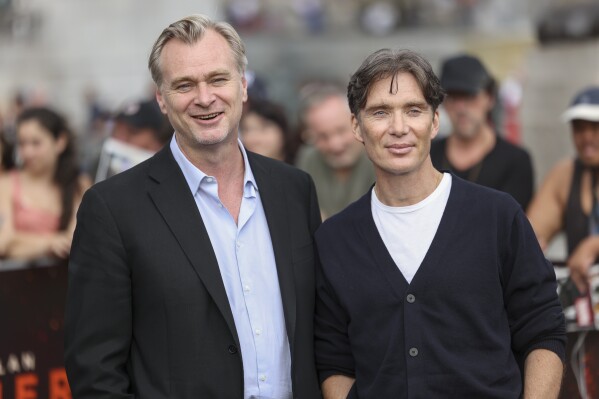 Director Christopher Nolan, left, and Cillian Murphy pose for photographers at the photo call for the film 'Oppenheimer' on Wednesday, July 12, 2023 in London. (Vianney Le Caer/Invision/AP)
