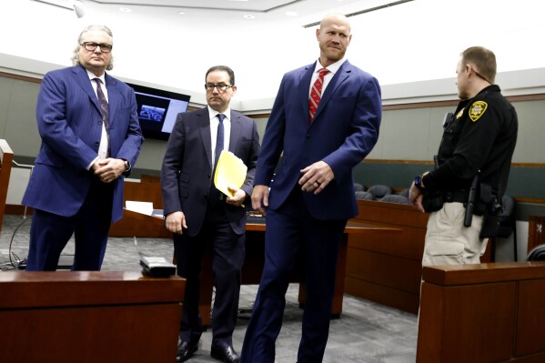 Daniel Rodimer, second right, leaves court with his attorneys David Chesnoff, left, and Richard Schonfeld after his arraignment at the Regional Justice Center in Las Vegas, Wednesday, May 8, 2024. Rodimer, a retired professional wrestler and former congressional candidate in Nevada and Texas has pleaded not guilty to a murder charge in the death of a man last year at a Las Vegas Strip hotel. (Bizuayehu Tesfaye/Las Vegas Review-Journal via AP)