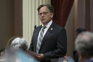 FILE - In this June 11, 2018, file photo, state Sen. Josh Newman, D-Fullerton, discusses the recall election against him, during a Senate session in Sacramento, Calif. Newman was recalled in 2018 before winning re-election in 2020. He presented new legislation on Monday, April 12, 2021, that would allow politicians facing recalls to see who signs the petitions against them. (AP Photo/Rich Pedroncelli, File)