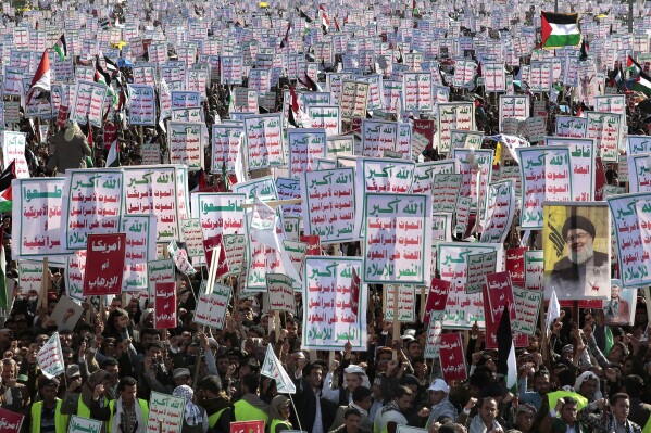 Houthi supporters attend a rally in support of the Palestinians in the Gaza Strip and against the U.S.-led airstrikes on Yemen, in Sanaa, Yemen, Friday, Jan. 26, 2024. (AP Photo/Osamah Abdulrahman)