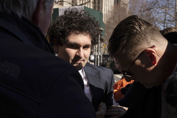 File - Sam Bankman-Fried, the founder and former CEO of the crypto exchange FTX, arrives at court in New York, on March. 30, 2023. A jury convicted Bankman-Fried of wire fraud and six other charges in November, 2023. (AP Photo/Yuki Iwamura, File)