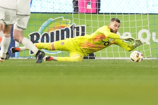 Toronto FC goalkeeper Luka Gavran dives for the ball in the first half of an MLS soccer match against New York City FC, Saturday, March 16, 2024, in New York. (AP Photo/Frank Franklin II)