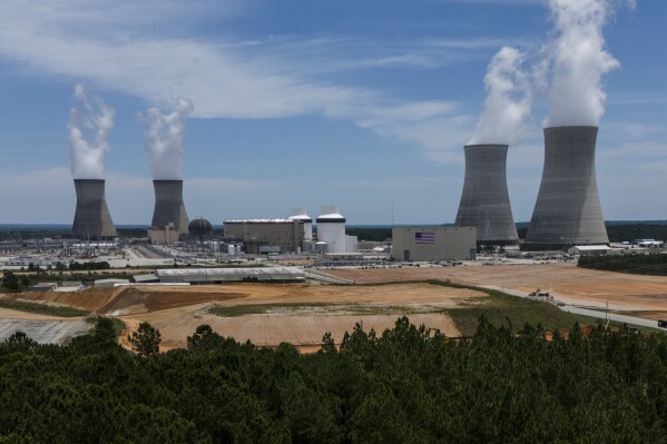 The four nuclear reactors and cooling towers are seen at the Alvin W. Vogtle Electric Generating Plant, Friday, May 31, 2024, in Waynesboro, Ga. (AP Photo/Mike Stewart)