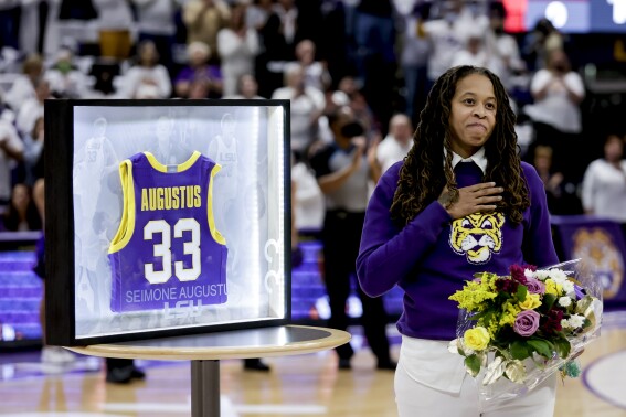FILE -Seimone Augustus is honored by LSU in a ceremony prior to an NCAA college basketball game against South Carolina in Baton Rouge, Thursday, Jan. 6, 2022. Seimone Augustus has returned to LSU to join the women’s basketball staff as an assistant coach, Coach Kim Mulkey announced Monday, May 20, 2024.(AP Photo/Derick Hingle, File)