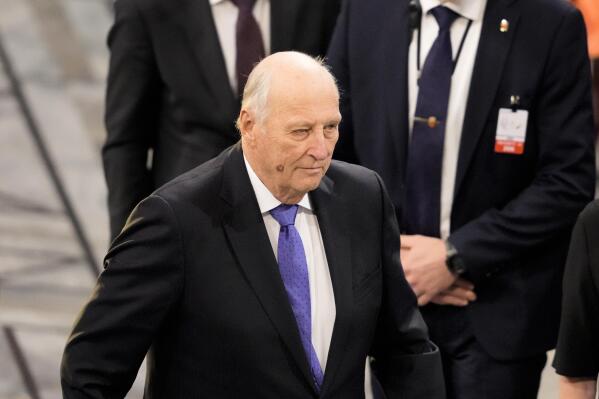 FILE - Norway's King Harald, centre, leaves the hall after the Nobel Peace Prize ceremony at Oslo City Hall, Norway, Saturday, Dec. 10, 2022. Norway’s aging King Harald V has been admitted to a hospital in the capital Oslo due to an infection and is being treated with intravenous antibiotics, the Norwegian palace said in a brief statement Monday, Dec. 19, 2022. (AP Photo/Markus Schreiber, File)