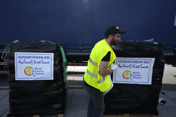 FILE - A member of the World Central Kitchen prepares a pallet with the humanitarian aid for transport to the port of Larnaca from where it will be shipped to Gaza, at a warehouse near Larnaca, Cyprus, on March 13, 2024. World Central Kitchen, the food charity founded by celebrity chef José Andrés, called a halt to its work in the Gaza Strip after an apparent Israeli strike killed seven of its workers, mostly foreigners. (AP Photo/Petros Karadjias, File)