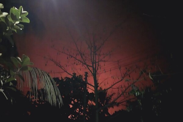 In this photo provided by a displaced Rohingya, the scarlet flames that came out from the burning of the houses in the town of Buthidaung in Rakhine state, Myanmar, are seen from a distance on May.17, 2024. (AP Photo)