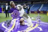 FILE - Handler Janice Hays poses for photos with Buddy Holly, a petit basset griffon Vendéen, after he won best in show during the 147th Westminster Kennel Club Dog show, Tuesday, May 9, 2023, at the USTA Billie Jean King National Tennis Center in New York. To the casual viewer, competing at the Westminster Kennel Club dog show might look as simple as getting a dog, grooming it and leading it around a ring. But there’s a lot more involved in getting to and exhibiting in the United States’ most prestigious canine event. (AP Photo/Mary Altaffer, File)