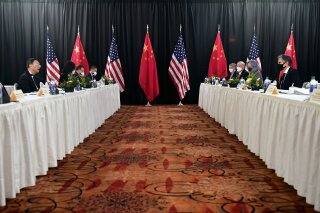 FIEL - In this March 18, 2021, file photo, Secretary of State Antony Blinken, second from right, joined by national security adviser Jake Sullivan, right, speaks while facing Chinese Communist Party foreign affairs chief Yang Jiechi, second from left, and China's State Councilor Wang Yi, left, at the opening session of U.S.-China talks at the Captain Cook Hotel in Anchorage, Alaska. China said Friday, March 19, 2021, a “strong smell of gunpowder and drama” resulted from talks with top American diplomats in Alaska, continuing the contentious tone of the first face-to-face meetings under the Biden administration. (Frederic J. Brown/Pool Photo via AP, File)