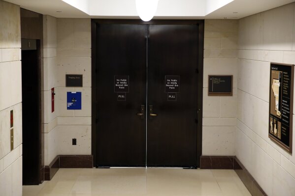 
              The entrance to the Office of Senate Security is seen on Capitol Hill, Wednesday night, Oct. 3, 2018 in Washington. (AP Photo/Alex Brandon)
            