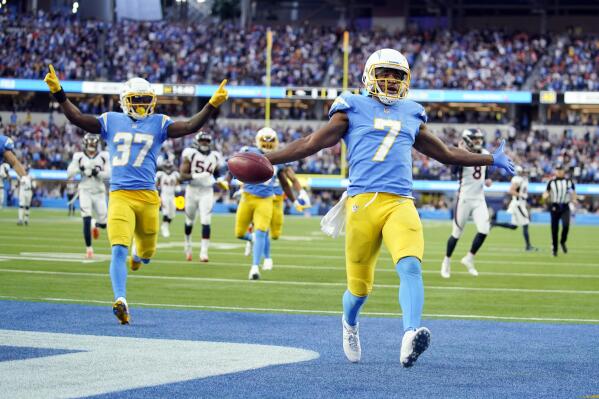 Los Angeles Chargers wide receiver Andre Roberts (7) returns a kick for a touchdown during the second half of an NFL football game against the Denver Broncos Sunday, Jan. 2, 2022, in Inglewood, Calif. (AP Photo/Jae C. Hong)