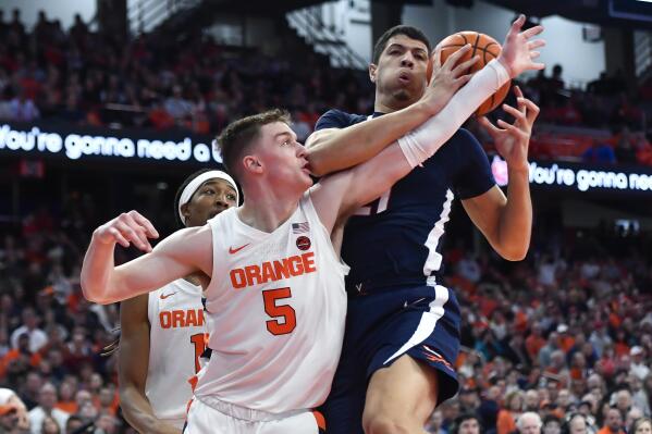 Syracuse forward Benny Williams, right, grabs a rebound in front