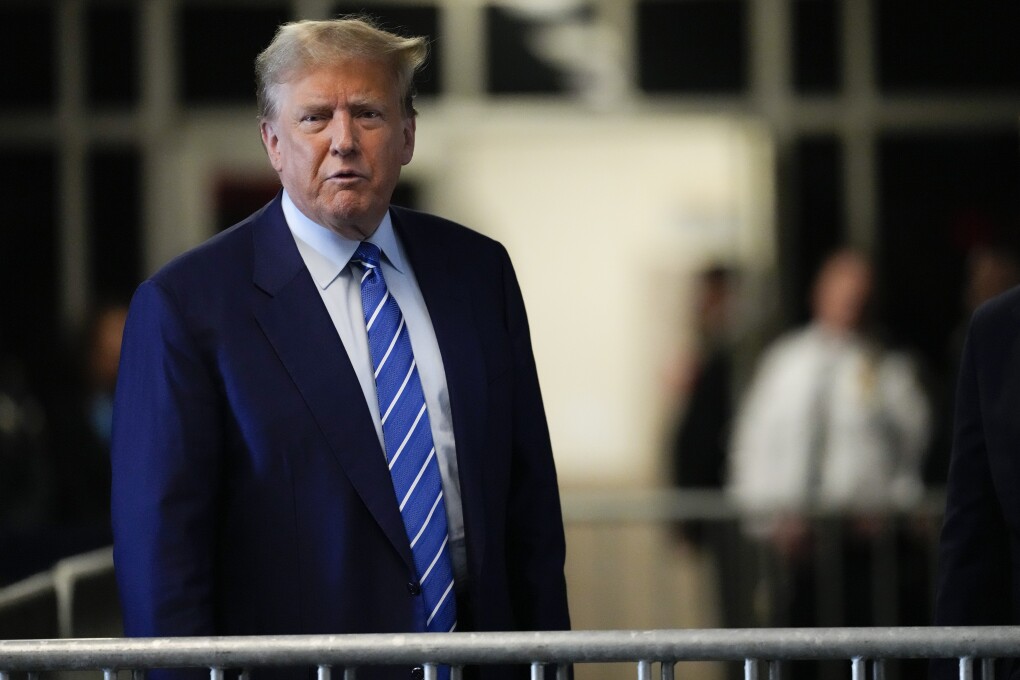 Former President Donald Trump speaks before entering the courtroom at Manhattan criminal court, Tuesday, April 16, 2024, in New York. Donald Trump returned to the courtroom Tuesday as a judge works to find a panel of jurors who will decide whether the former president is guilty of criminal charges alleging he falsified business records to cover up a sex scandal during the 2016 campaign. (AP Photo/Mary Altaffer)