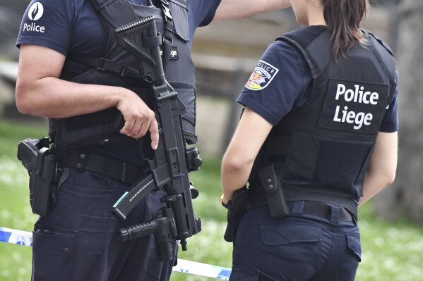 
              Belgian police guard the scene of a shooting in Liege, Belgium, Tuesday, May 29, 2018. A gunman killed three people, including two police officers, in the Belgian city of Liege on Tuesday, a city official said. Police later killed the attacker, and other officers were wounded in the shooting.(AP Photo/Geert Vanden Wijngaert)
            