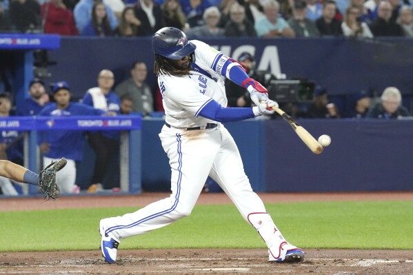 Dodgers top off epic run with 14-5 rout of Toronto, take first in
