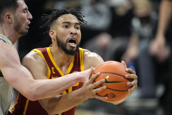 Southern California forward Isaiah Mobley, right, drives past Colorado guard Luke O'Brien during the first half of an NCAA college basketball game Thursday, Jan. 20, 2022, in Boulder, Colo. (AP Photo/David Zalubowski)