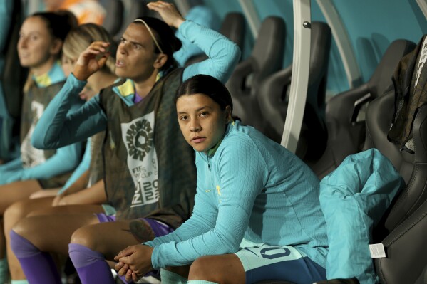 Australia's Sam Kerr walks sits on the bench before the Women's World Cup Group B soccer match between Australia and Canada in Melbourne, Australia, Monday, July 31, 2023. (AP Photo/Hamish Blair)