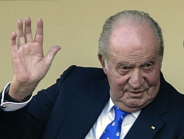 FILE - In this file photo dated June 2, 2019, Spain's former King Juan Carlos waves at the bullring in Aranjuez, Spain. Former Spanish King Juan Carlos I has won his London court battle with an ex-lover who sought $153 million in damages for allegedly being harassed and spied after their breakup. Danish socialite and businessperson Corinna Larsen, also known as Corinna zu Sayn-Wittgenstein said the former monarch caused her “great mental pain” by orchestrating threats and ordering unlawful covert and overt surveillance of her. A London judge tossed out her case and ruled that British courts don't have jurisdiction over the case because Larsen hadn't proved the harassment occurred in England and the king doesn't live there. (AP Photo/Andrea Comas, FILE)
