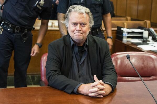 FILE - Former White House strategist Steve Bannon waits for his arraignment in Manhattan State Supreme Court after surrendering to authorities on Sept. 8, 2022, in New York. Bannon, a conservative strategist and longtime ally of former President Donald Trump, was sued for breach of contract Friday, Feb. 17, 2023, by a Manhattan law firm that defended him in several recent high-profile legal battles. (Steven Hirsch/New York Post via AP, Pool, File)