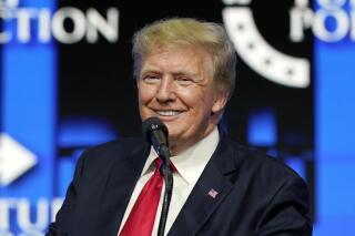 FILE - Former President Donald Trump smiles as he pauses while speaking to supporters at a Turning Point Action gathering in Phoenix, July 24, 2021. A congressional oversight committee on Thursday, April 7, 2022, said the Justice Department is “obstructing” its investigation into Trump's handling of White House records by preventing the release of information from the National Archives. (AP Photo/Ross D. Franklin, File)