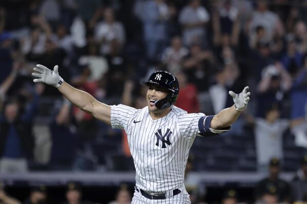 New York Yankees' Giancarlo Stanton gestures after his grand slam against the Pittsburgh Pirates during the ninth inning of a baseball game Tuesday, Sept. 20, 2022, in New York. (AP Photo/Jessie Alcheh)